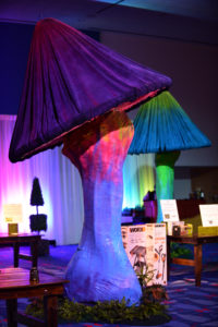 Oversized mushrooms created a magical setting in this Alice in Wonderland themed auction area.
