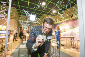 An interactive dry-erase glass wall.