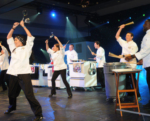 This customized show turned a corporation’s kitchen equipment into instruments creating a unique opening number for this corporate awards program revealing the company CEO as part of the act!