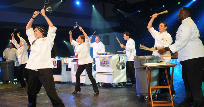 This customized show turned a corporation’s kitchen equipment into instruments creating a unique opening number for this corporate awards program revealing the company CEO as part of the act!