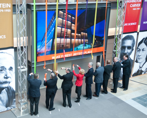 This unique ribbon-cutting concept created a striking photo opportunity for press. Upon declaration that the new building was open, nine ribbons unfurled from the ceiling for key leaders and community VIPs to cut.